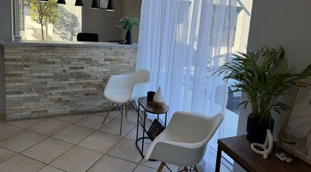 Elegant waiting area at Laser Erase - Centurion in Centurion, Gauteng, ZA with modern chairs and decor.