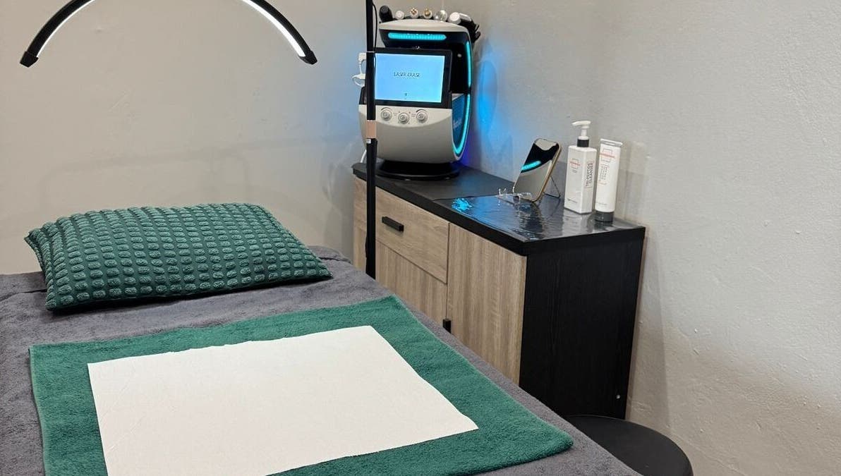 Cozy treatment room at Laser Erase - Centurion, Centurion, Gauteng, ZA with comfy bed and laser equipment.