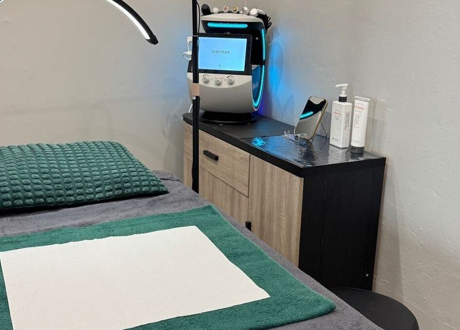 Cozy treatment room at Laser Erase - Centurion, Centurion, Gauteng, ZA with comfy bed and laser equipment.
