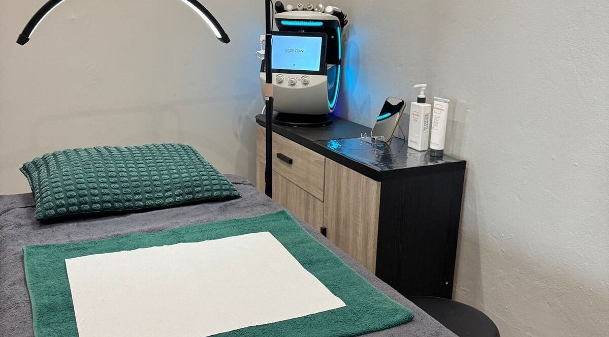 Cozy treatment room at Laser Erase - Centurion, Centurion, Gauteng, ZA with comfy bed and laser equipment.