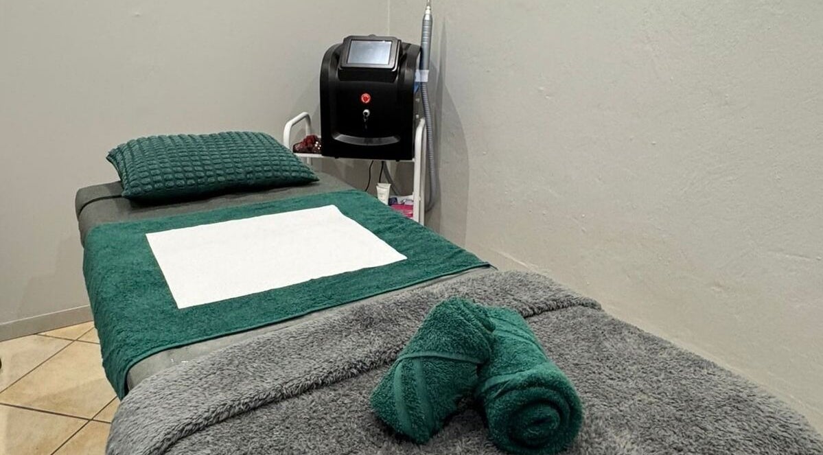Cozy treatment room at Laser Erase - Centurion, with a neatly set bed in Centurion, Gauteng, ZA.