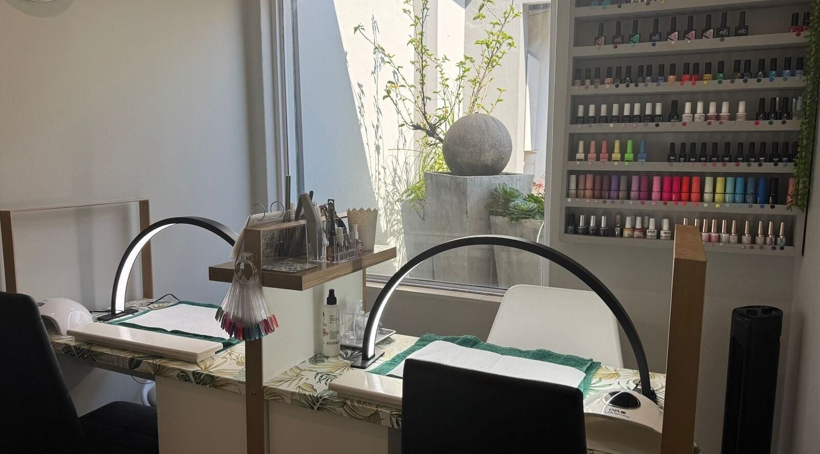 Modern nail salon at Laser Erase - Centurion with vibrant polish display; Centurion, Gauteng, ZA.