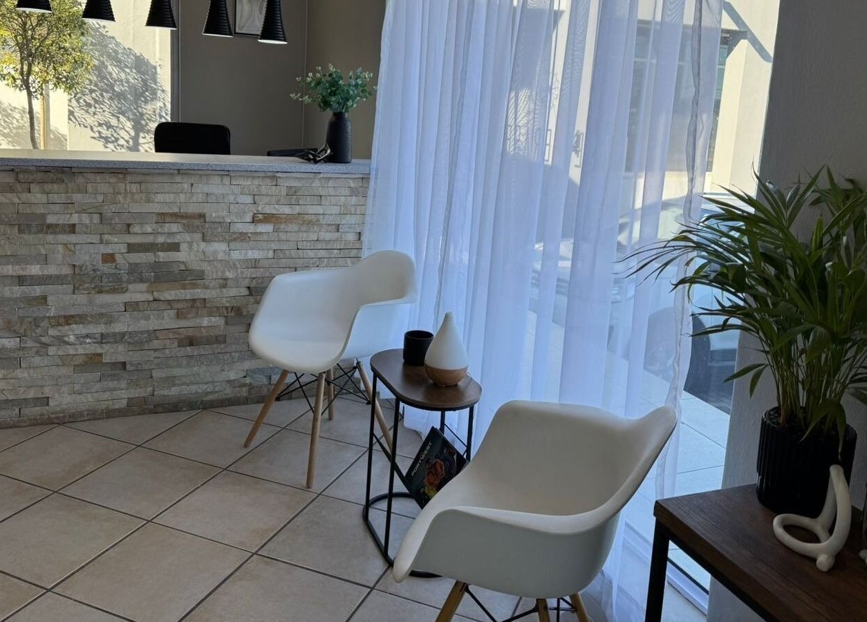 Elegant waiting area at Laser Erase - Centurion with modern chairs and plants, Centurion, Gauteng, ZA.