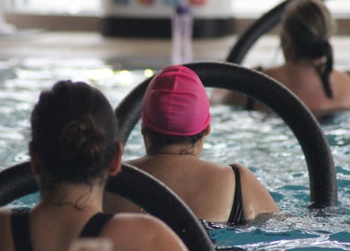 Aquafit class at The Pool @ Aspire, Stanmore, England, GB featuring engaged participants in an invigorating session.
