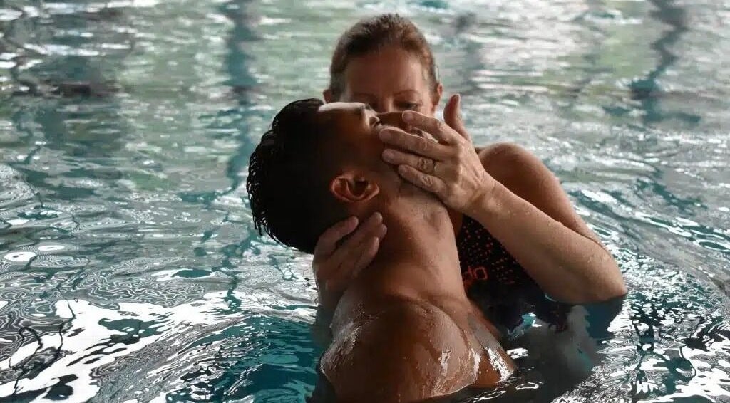 Therapist supports client in a pool session at Aquatic Therapeutics in The Pool, Stanmore, England, GB.