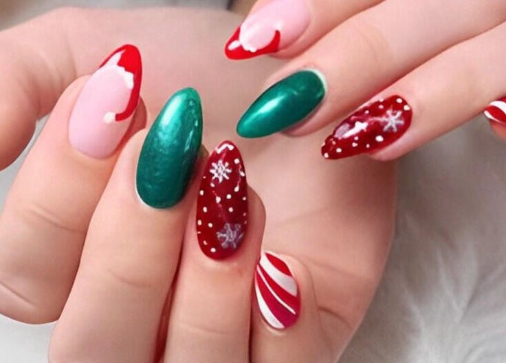 Vibrant holiday-themed nails at Kingdom Nails, Auckland, NZ, featuring red, green, and candy cane designs.