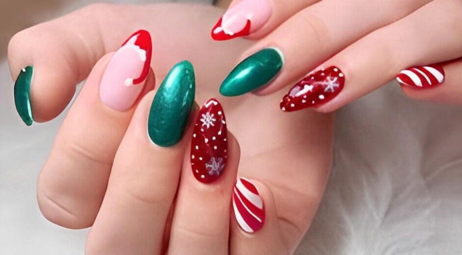 Vibrant holiday-themed nails at Kingdom Nails, Auckland, NZ, featuring red, green, and candy cane designs.
