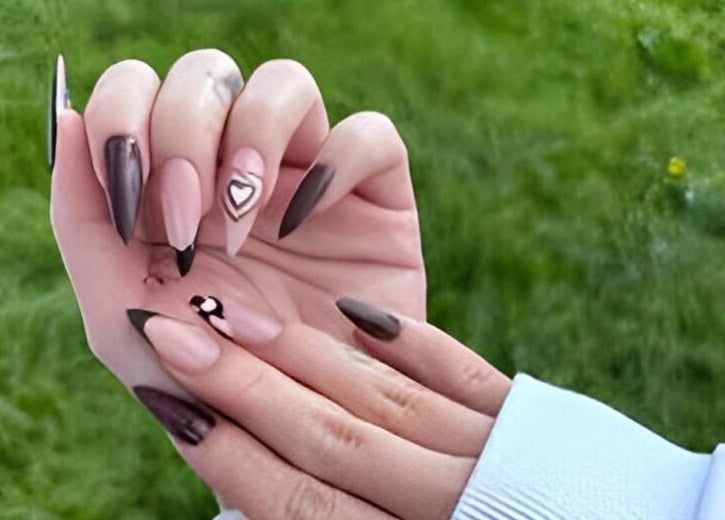 Elegant nail art with heart details from Kingdom Nails in Auckland, NZ. Perfect for stylish manicures.