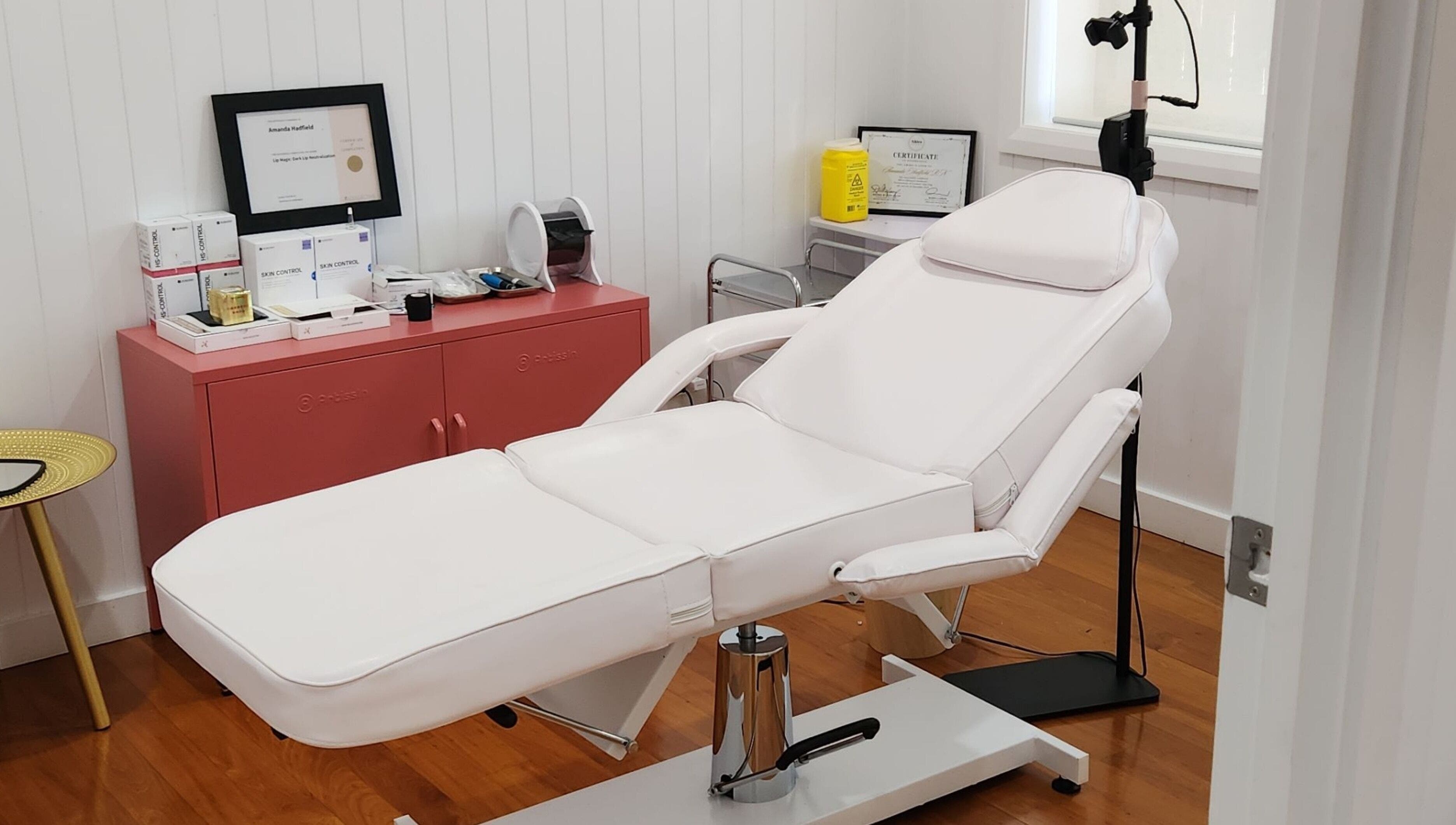 Relaxing treatment room at The Aesthetic Studio Toowoomba in Toowoomba, Queensland, AU with white spa chair.