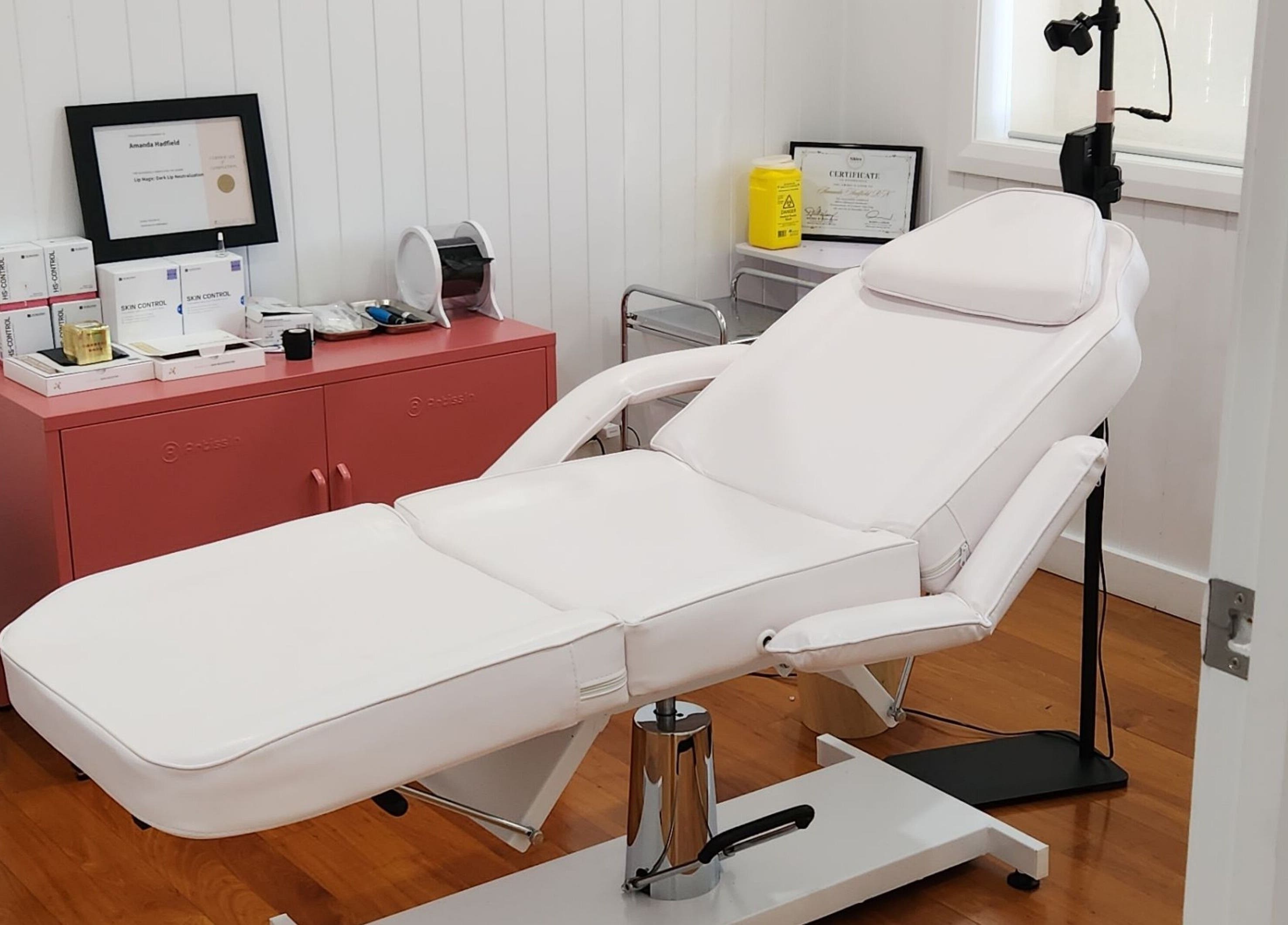 Relaxing treatment room at The Aesthetic Studio Toowoomba in Toowoomba, Queensland, AU with white spa chair.