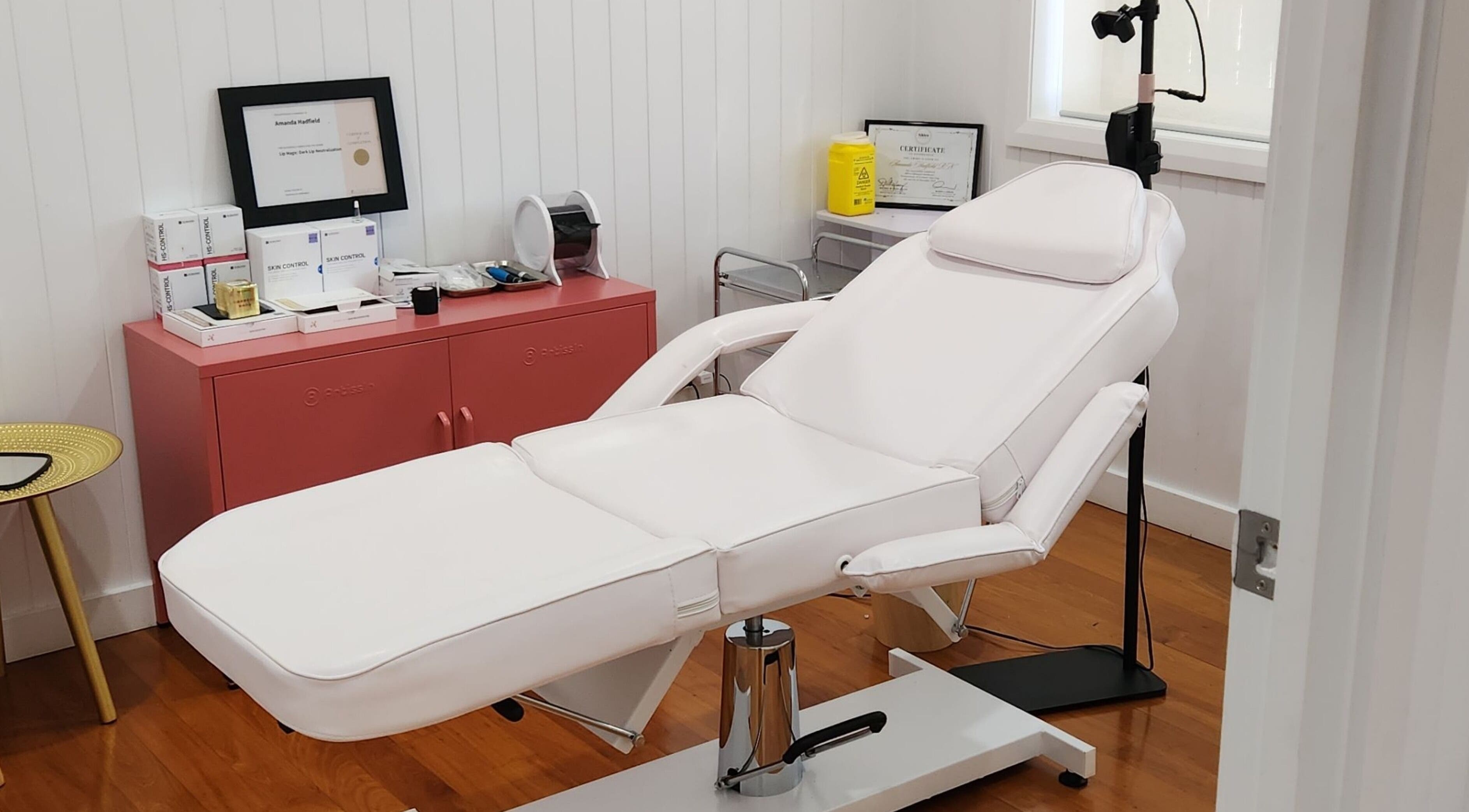 Relaxing treatment room at The Aesthetic Studio Toowoomba in Toowoomba, Queensland, AU with white spa chair.