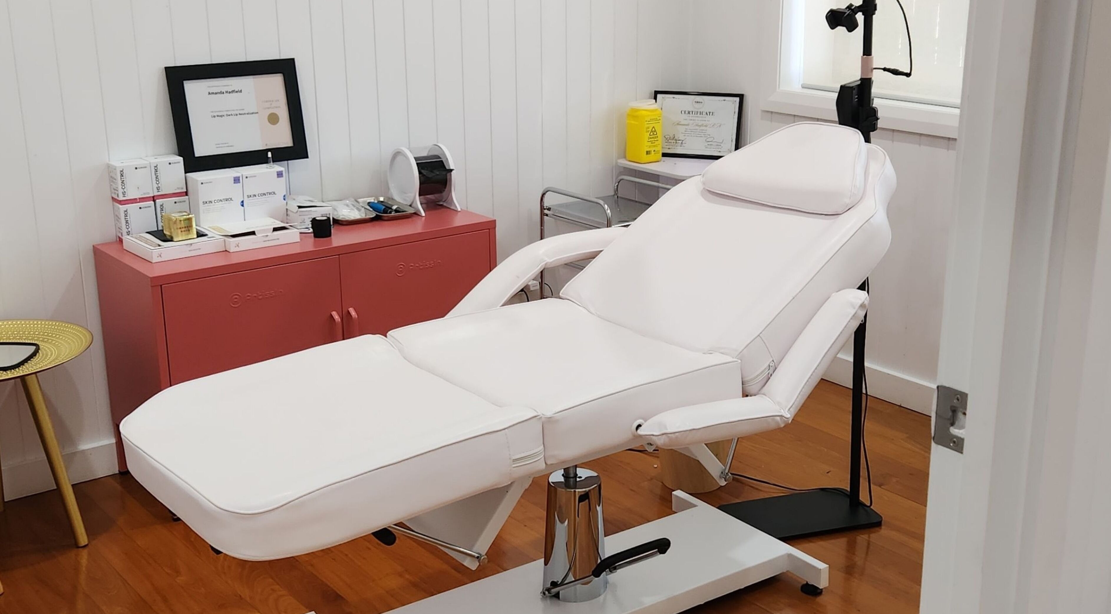 Relaxing treatment room at The Aesthetic Studio Toowoomba in Toowoomba, Queensland, AU with white spa chair.