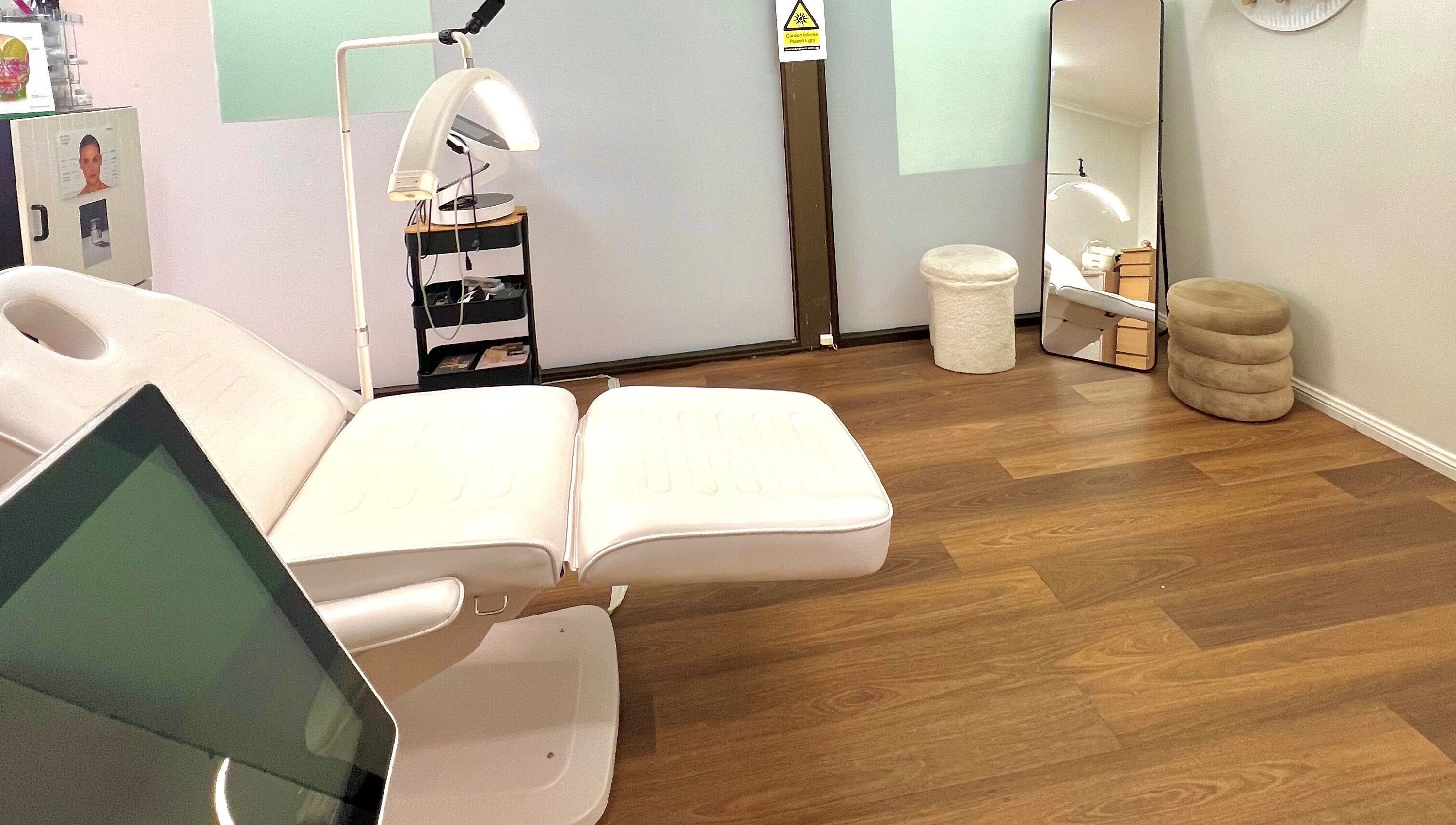 Relaxing treatment room at VM Cosmetic Clinic, Orange, New South Wales, AU with modern amenities and calming decor.