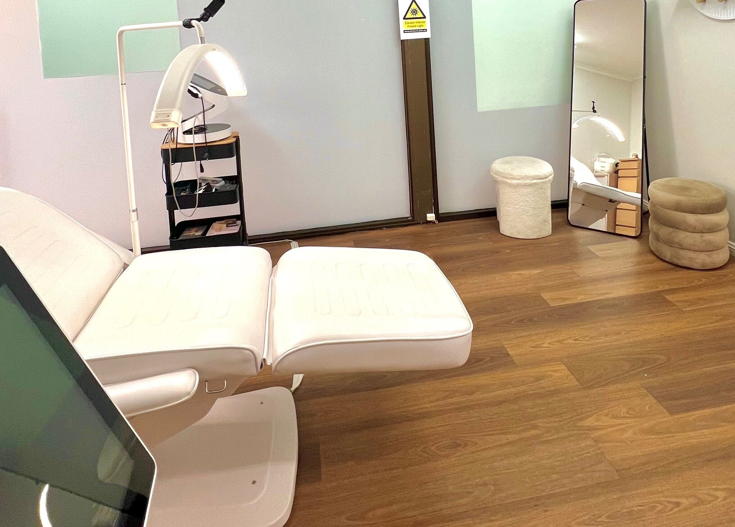 Relaxing treatment room at VM Cosmetic Clinic, Orange, New South Wales, AU with modern amenities and calming decor.