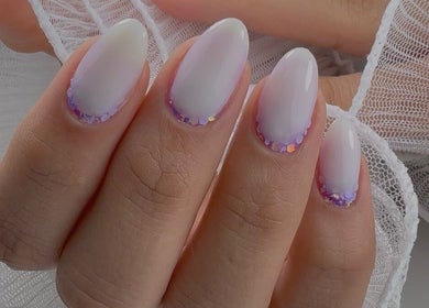 Stylish glitter manicure at Carli Manicure in Melbourne, Victoria, AU, showcasing trendy nail art.