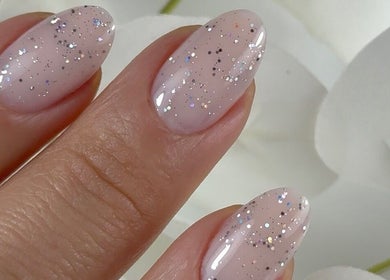 Sparkling manicure at Carli Manicure in Melbourne, Victoria, AU showcases elegant glittery nails.