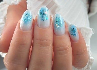 Elegant blue glitter nail art at Carli Manicure in Melbourne, Victoria, AU.
