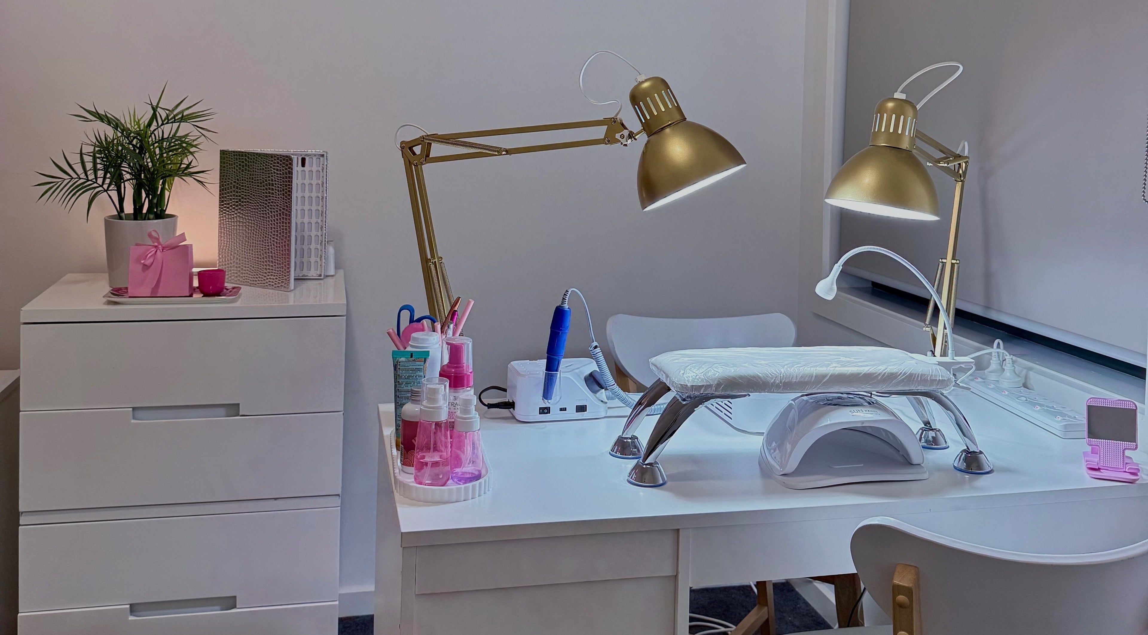Cozy manicure setup at Carli Manicure, Melbourne, Victoria, AU, featuring elegant lamps and tools.