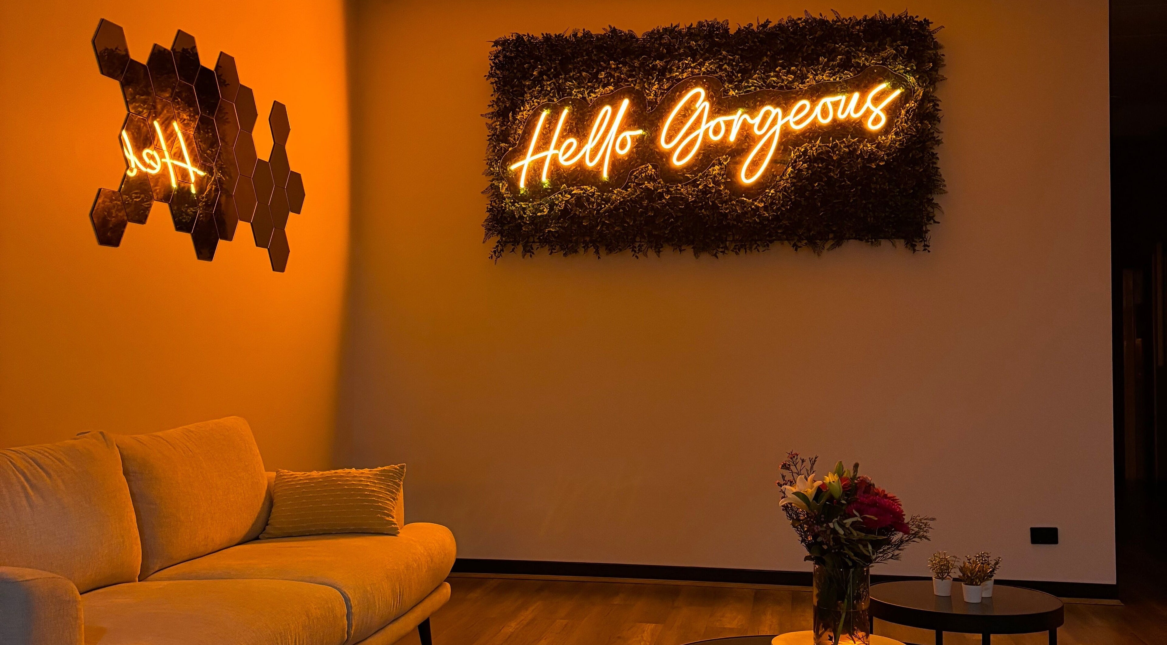 Cozy seating and 'Hello Gorgeous' neon at SakuraStudio | Spray Tan, Canning Vale, Western Australia, AU.