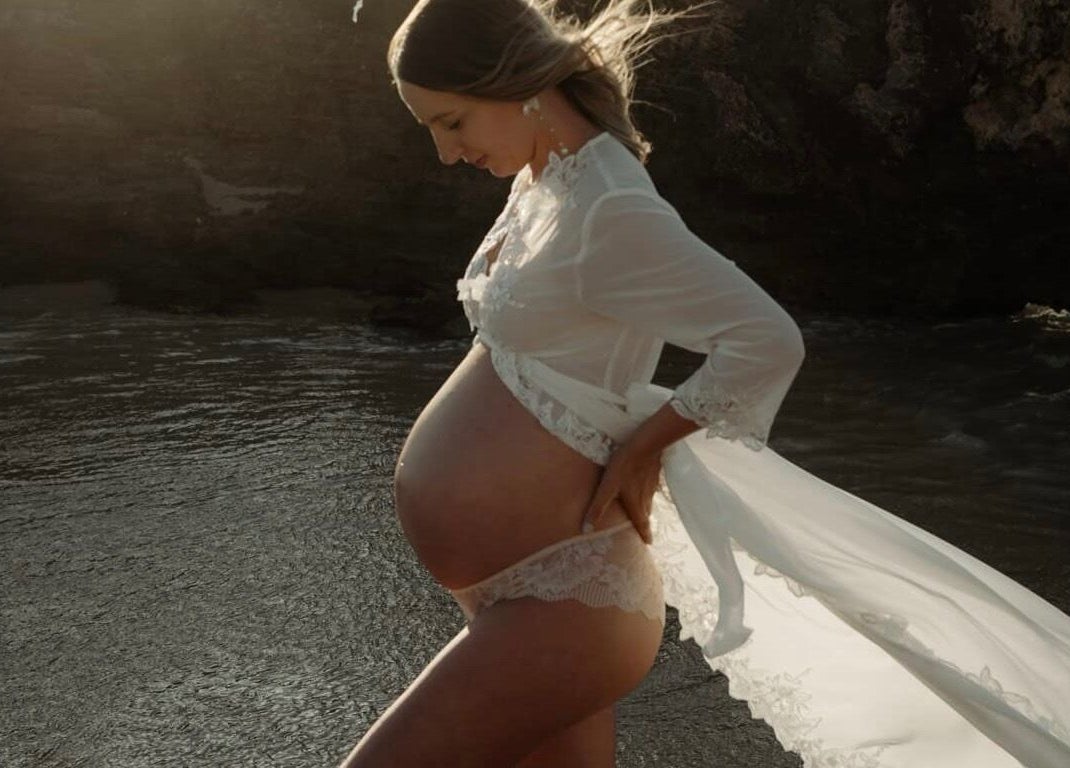 A pregnant woman in a lace robe at the beach, captured near SakuraStudio | Spray Tan, Canning Vale, Western Australia, AU.