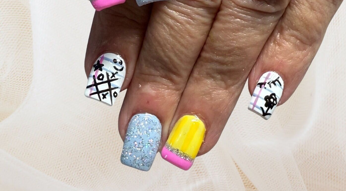 Creative nail art featuring colorful designs at Polished Nail and Brow Lounge, Dunedin, Florida, US.