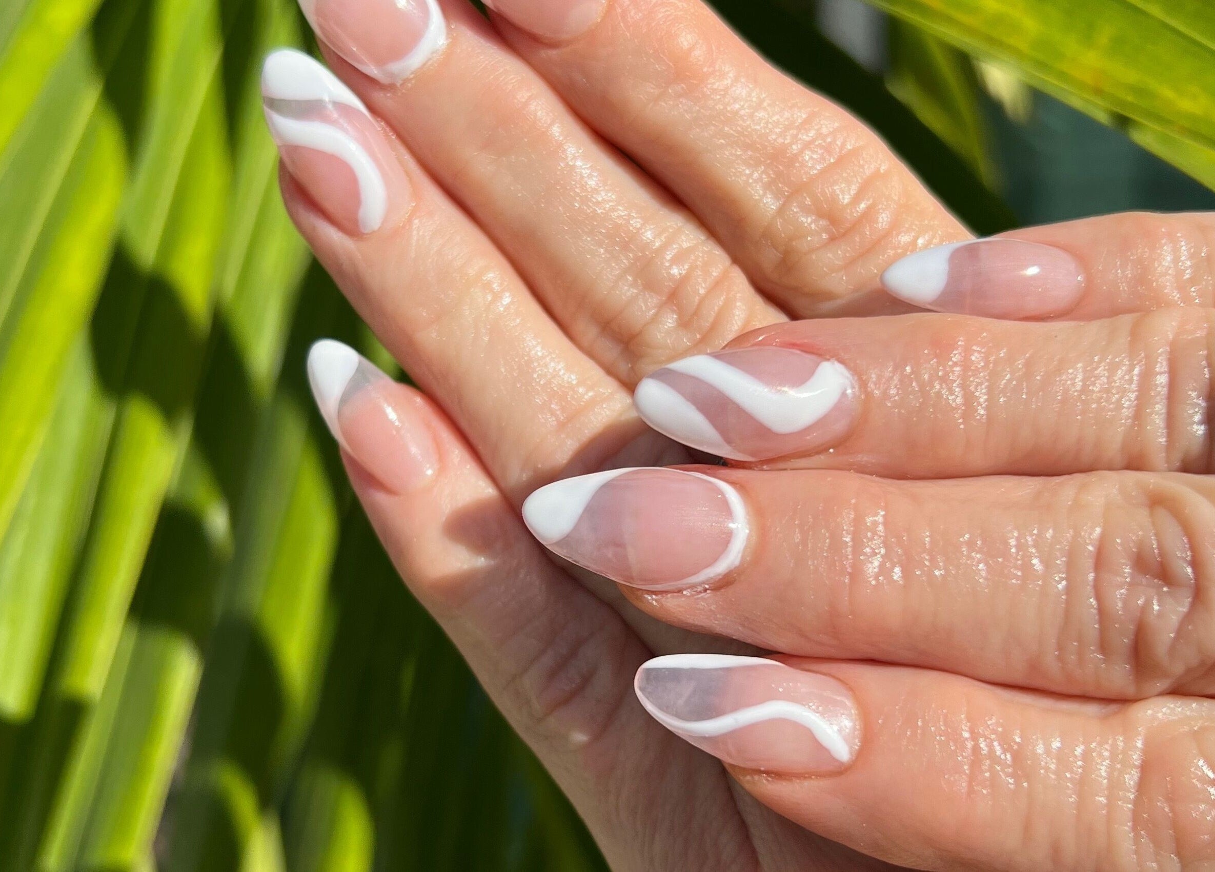 Elegant white nail art at Polished Nail and Brow Lounge, Dunedin, Florida, US, showcasing expert nail design.