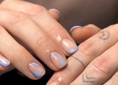 Elegant blue nail art at Polished Nail and Brow Lounge in Dunedin, Florida, US.