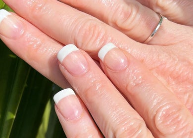 Close-up of French manicure at Polished Nail and Brow Lounge, Dunedin, Florida, USA.