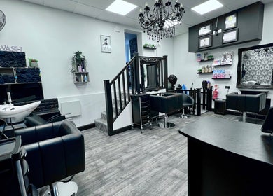 Chic interior of The Little Hair & Beauty Studio in Newark, England, GB with modern styling chairs and decor.