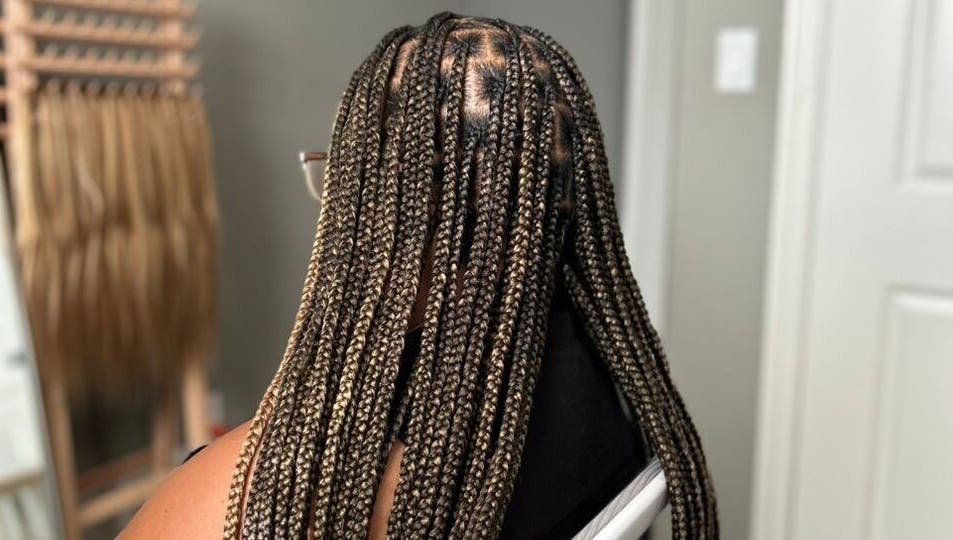 Braided hairstyle at D’lene Hair, Thorold, Ontario, CA, showcasing intricate and stylish hair braiding.