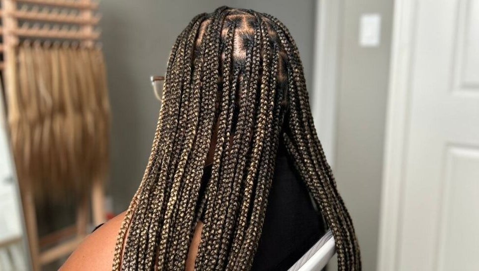 Braided hairstyle at D’lene Hair, Thorold, Ontario, CA, showcasing intricate and stylish hair braiding.