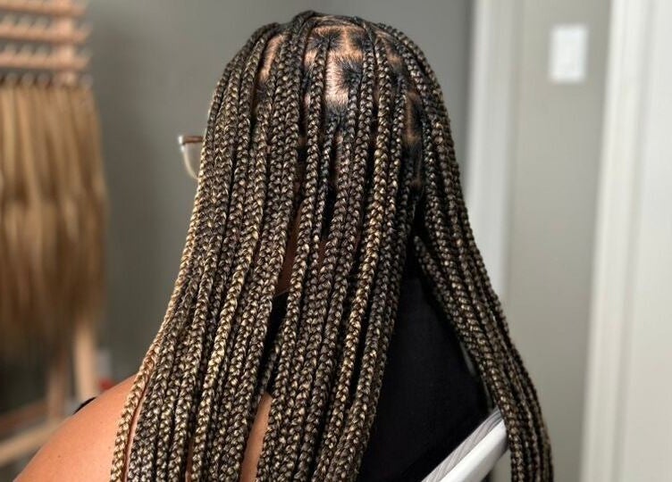 Braided hairstyle at D’lene Hair, Thorold, Ontario, CA, showcasing intricate and stylish hair braiding.