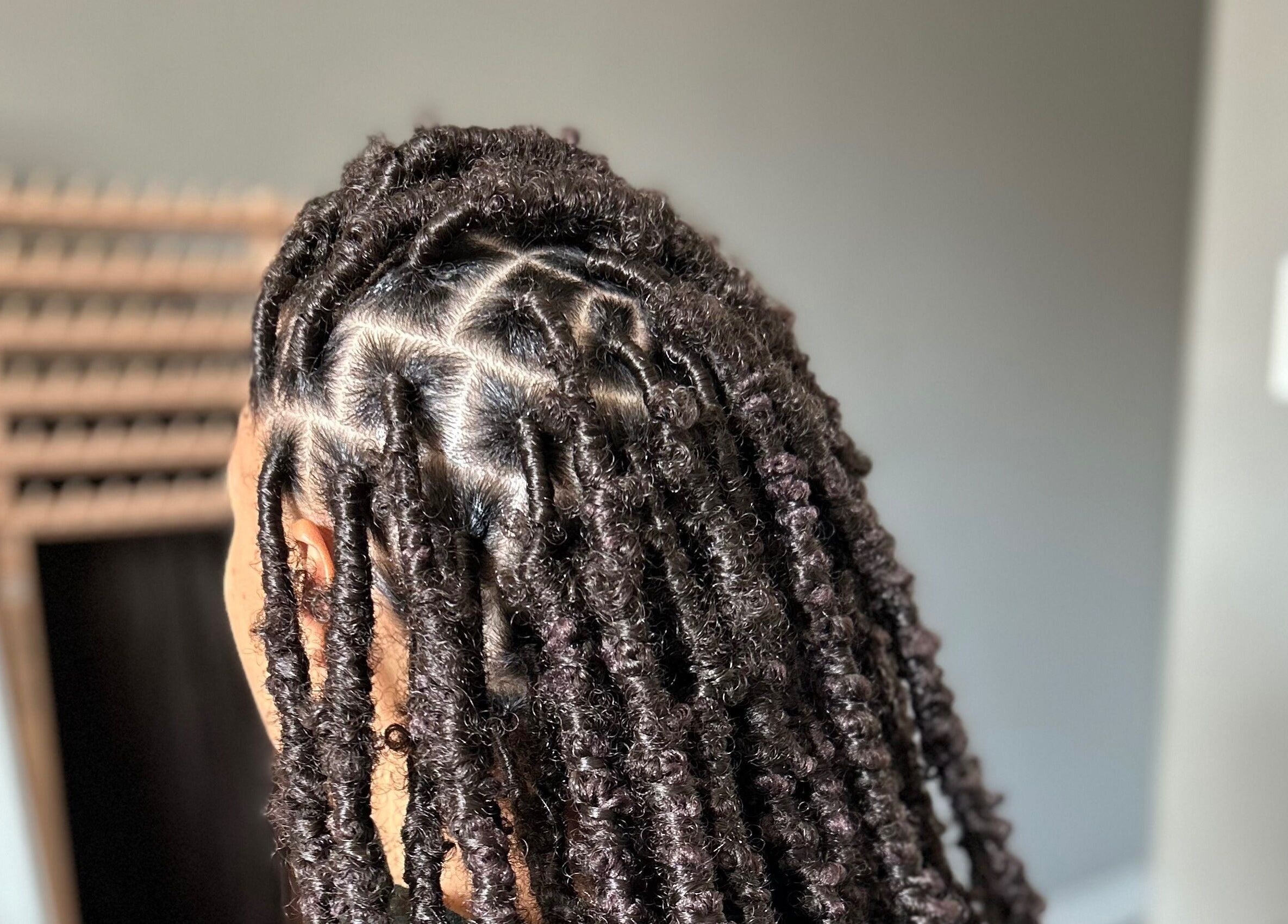 Detailed view of intricate braids at D’lene Hair in Thorold, Ontario, CA, showcasing expert hairstyling.