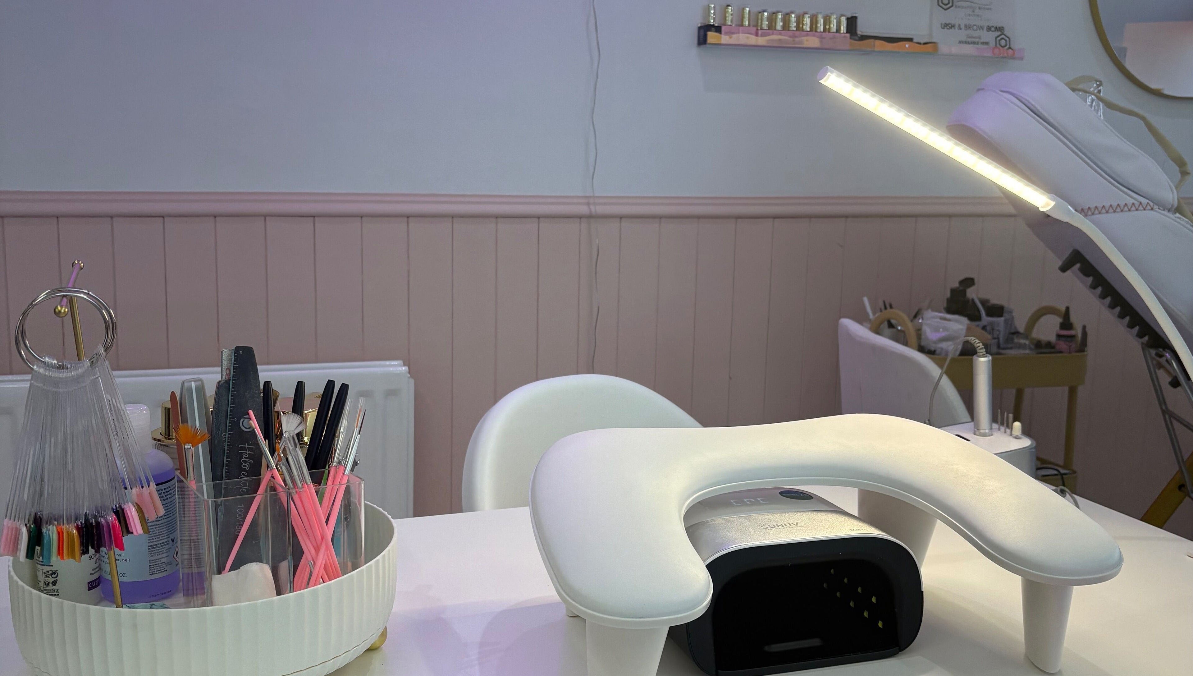 Nail station setup at By EJG beauty lounge in Redcar, England, GB with tools and UV lamp.