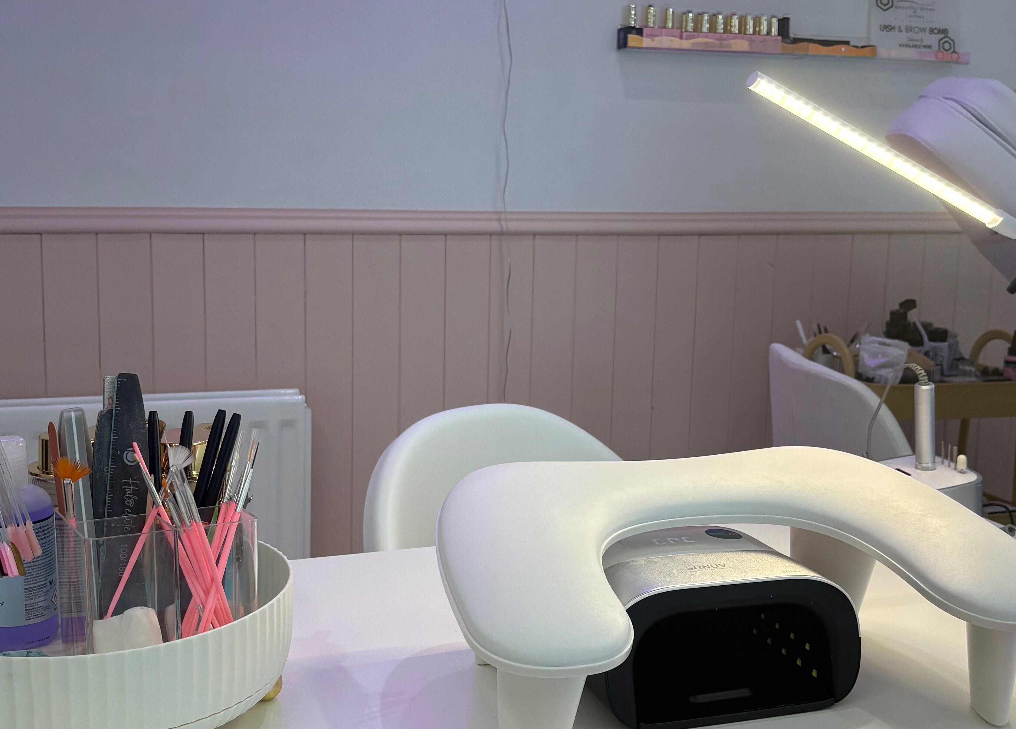 Nail station setup at By EJG beauty lounge in Redcar, England, GB with tools and UV lamp.
