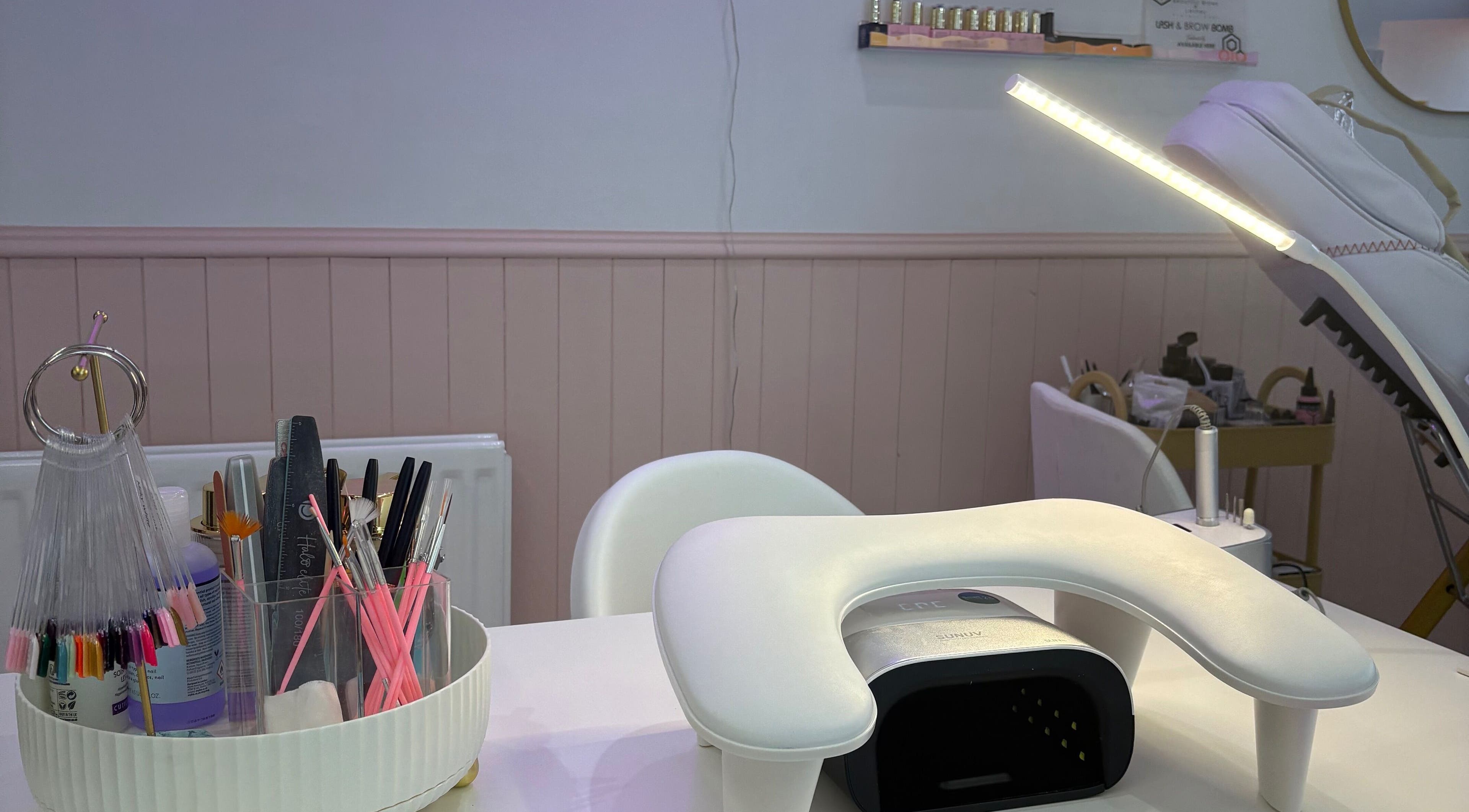 Nail station setup at By EJG beauty lounge in Redcar, England, GB with tools and UV lamp.