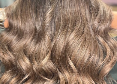 Lustrous wavy hair styled at Anna Francesca hair & beauty in Campbelltown, New South Wales, AU.