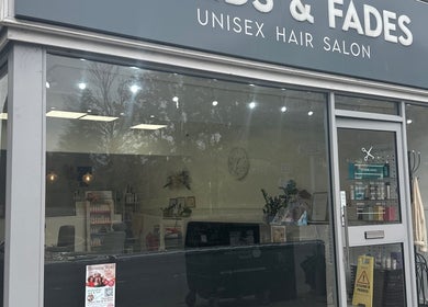 Exterior of Braids & Fades unisex hair salon in Hereford, England, GB, showcasing modern salon front.