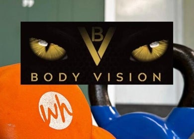 Bright kettlebells at Bodyvision gym, Old Colwyn, Wales, GB, showcasing fitness and strength.