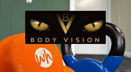 Bright kettlebells at Bodyvision gym, Old Colwyn, Wales, GB, showcasing fitness and strength.