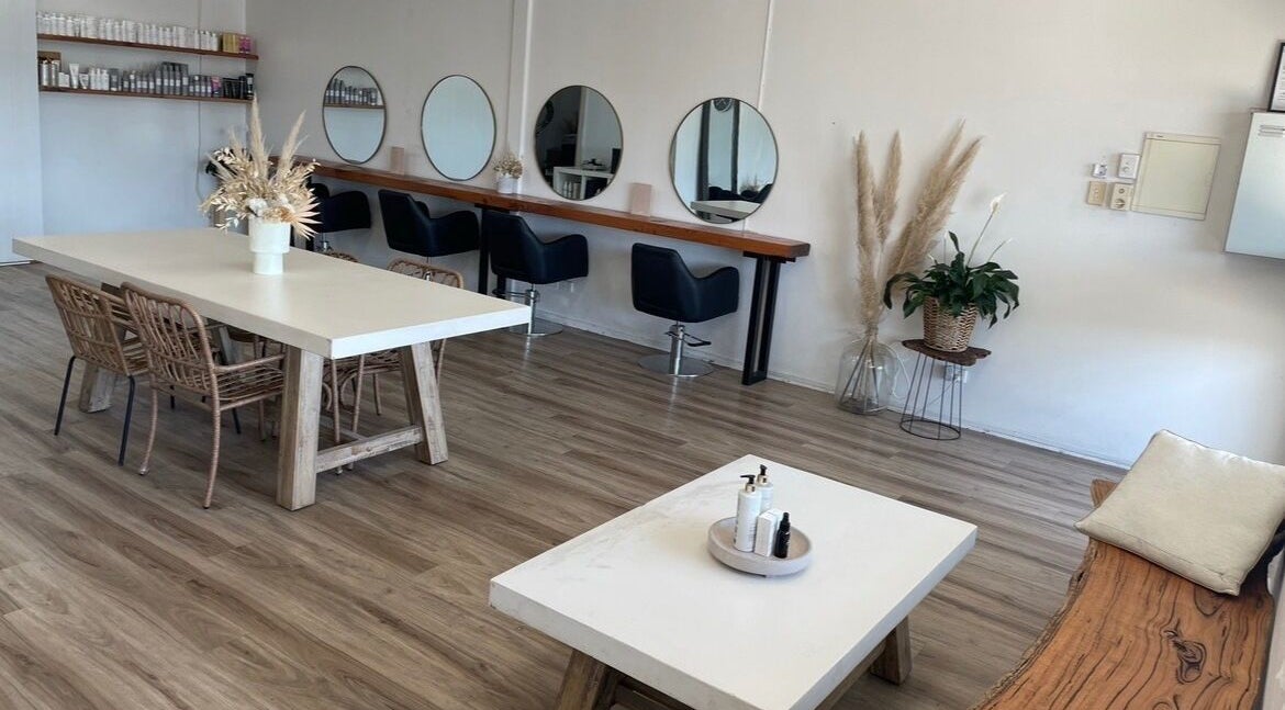 Elegant salon interior at Grantville DC Coastal Hair & Co, Grantville, Victoria, AU. Modern seating and mirrors.