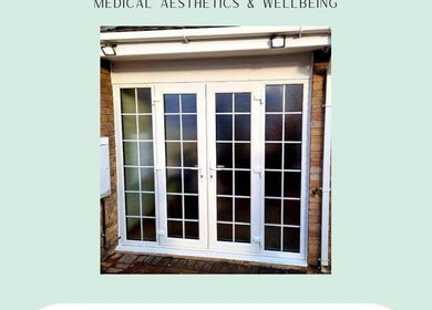 Entrance of Mes Amis Aesthetics, Abbeydale, England, featuring white double glass doors.