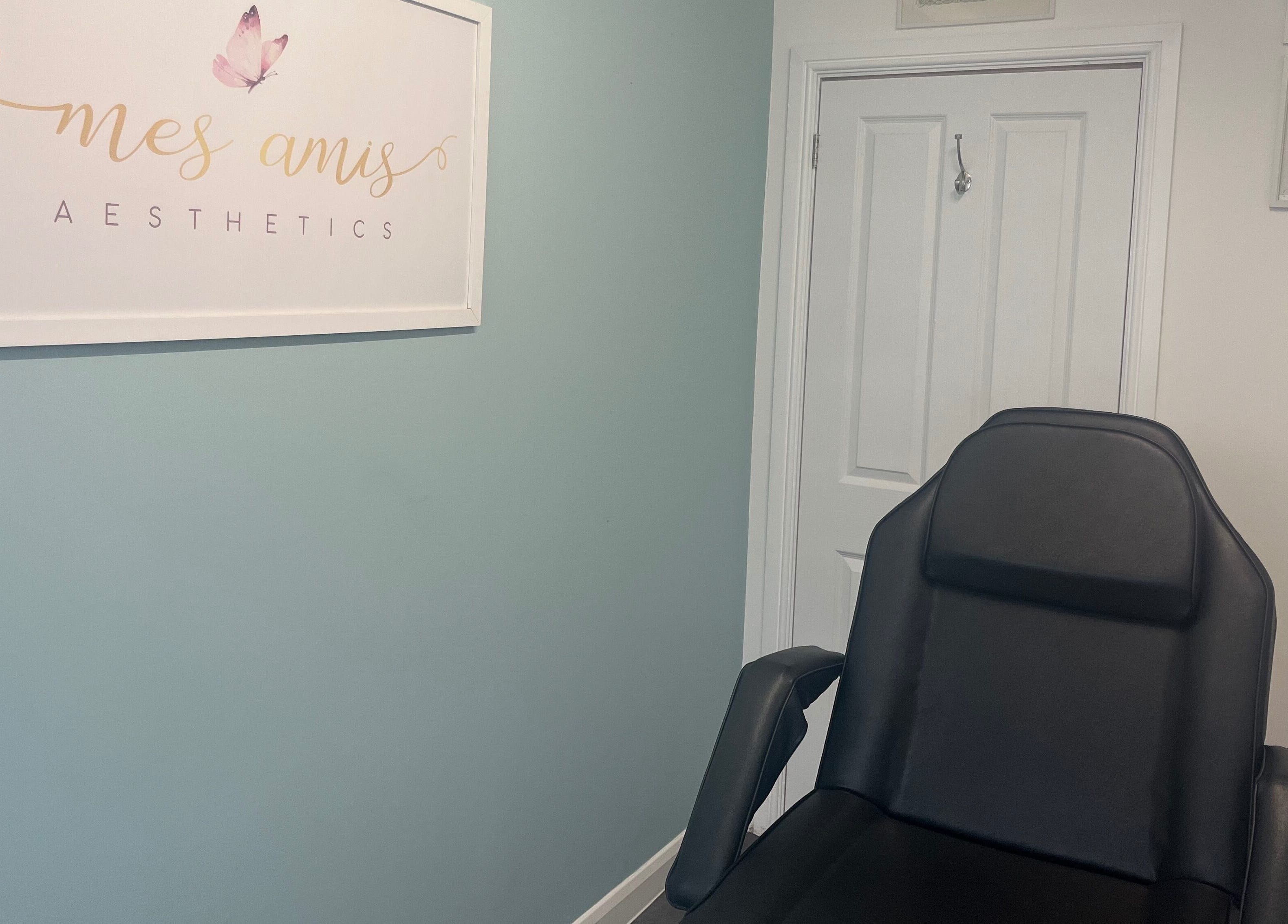 Cozy treatment room at Mes Amis Aesthetics in Abbeydale, England, featuring a comfortable chair and calming decor.
