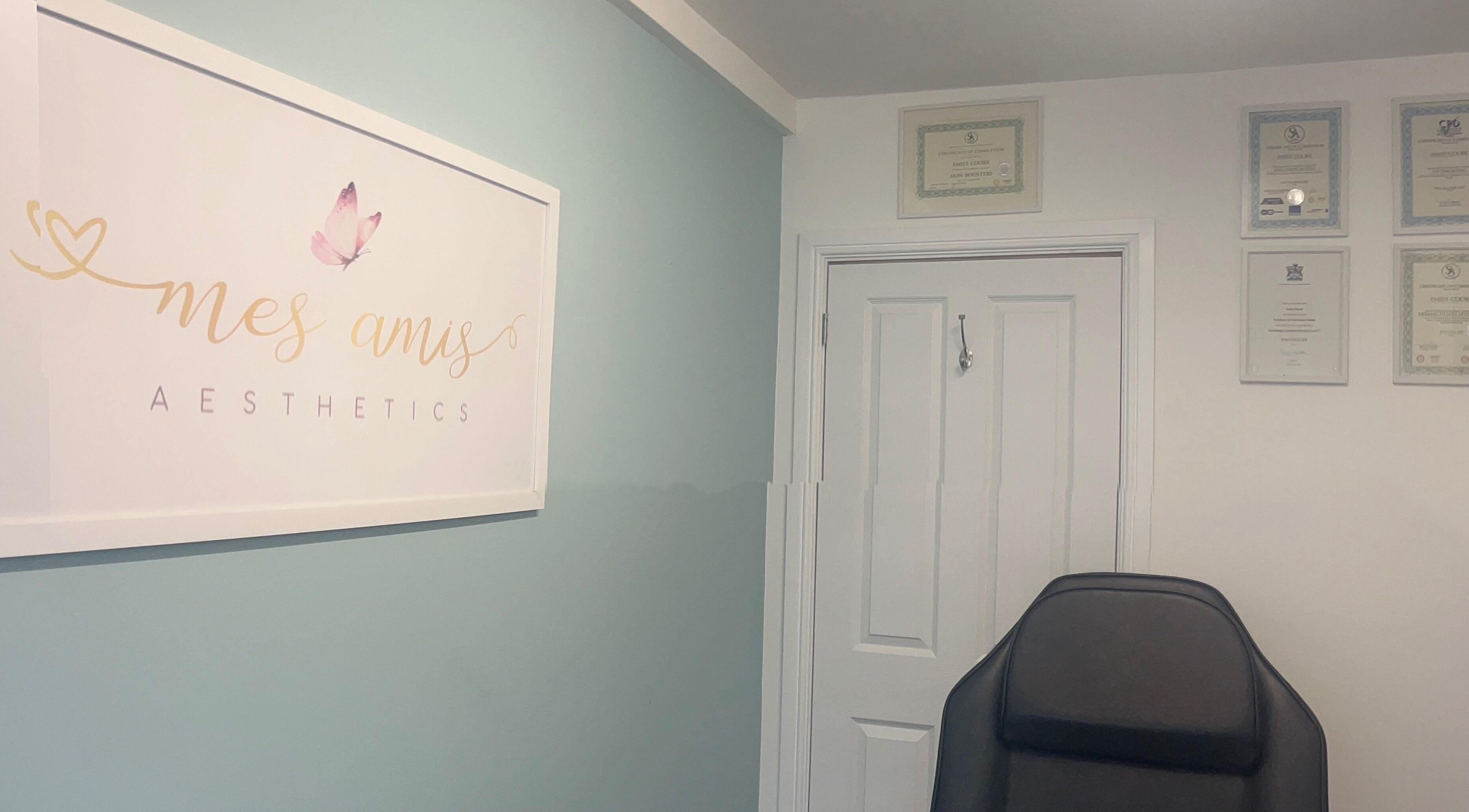 Interior of Mes Amis Aesthetics in Abbeydale, England with certificates and logo on display.
