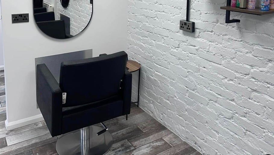 Stylish hair styling chair at No40 Hair & Beauty in Camborne, England, GB, with modern interior decor.