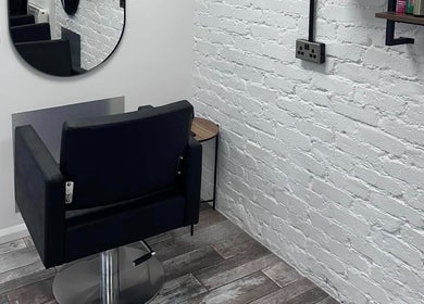 Stylish hair styling chair at No40 Hair & Beauty in Camborne, England, GB, with modern interior decor.