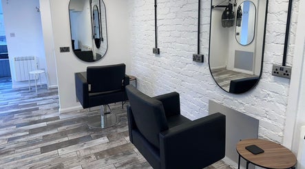 Modern salon interior with mirrors and chairs at No40 Hair & Beauty, Camborne, England, GB.