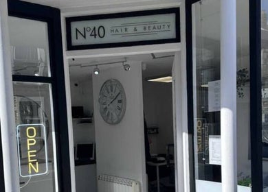 Entrance of No40 Hair & Beauty in Camborne, England, GB, showcasing a stylish open sign.