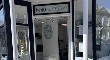 Entrance of No40 Hair & Beauty in Camborne, England, GB, showcasing a stylish open sign.