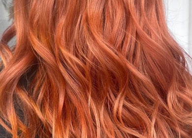 Vibrant red hair styled with waves at No40 Hair & Beauty, Camborne, England, GB.